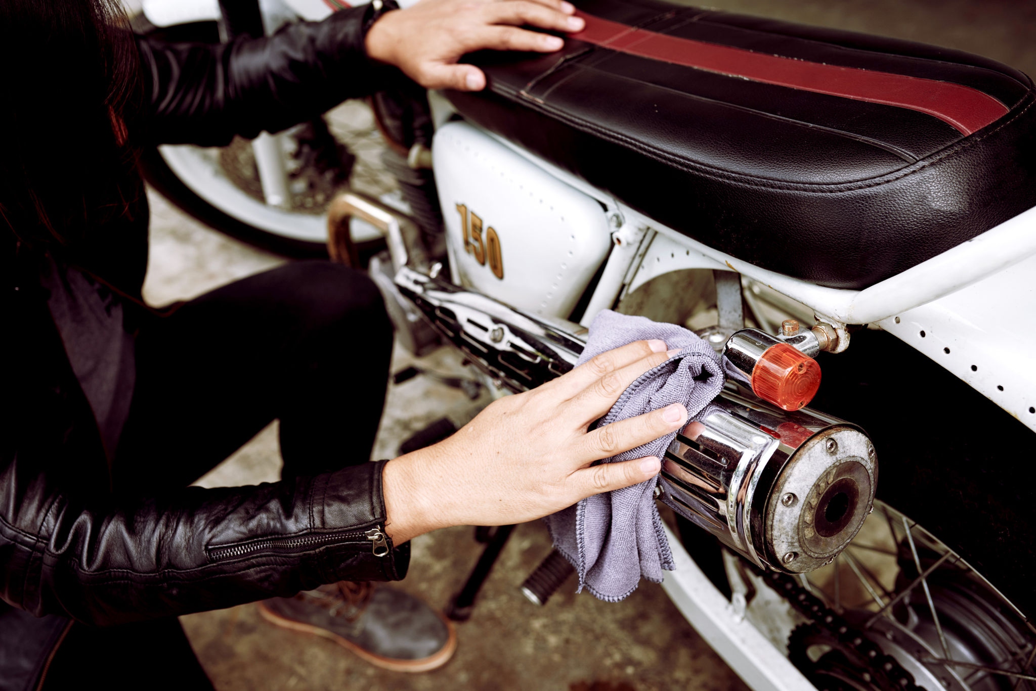 Cleaning a classic motorcycle with cloth